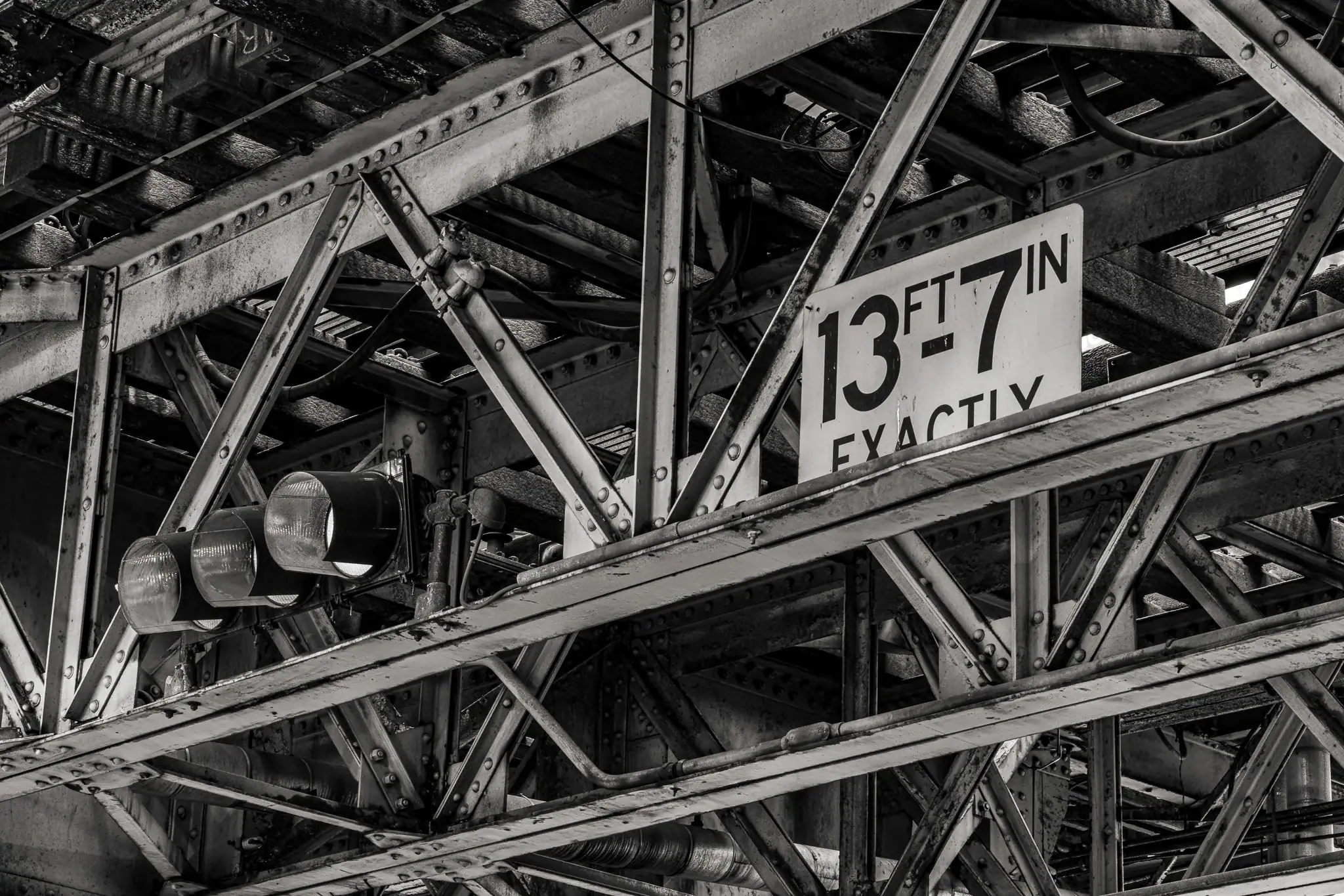 Chicago downtown street under L train tracks with steel shadows