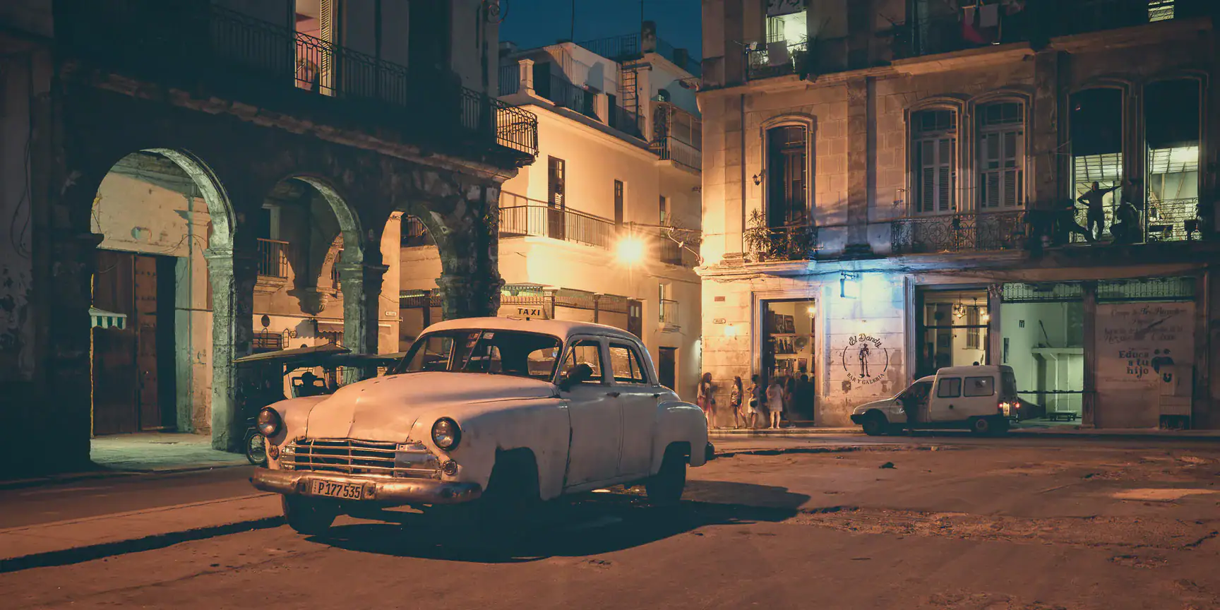 Dimly lit buildings in Old Havana street scene at night